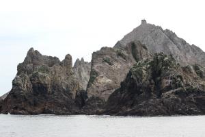 Rocks of Farallon Islands with high point in background