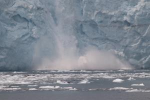 Ice fall on glacier into ocean