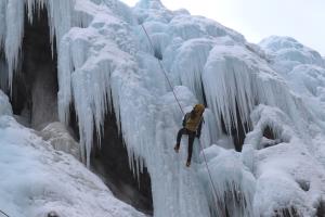 Climber rappelling into South Park section of Ouray Ice Park