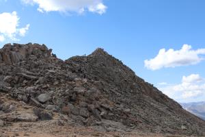 Final scramble to summit of Mt. Yale with hikers