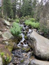 12:27PM a waterfall on the trail below treeline descending Longs Peak