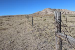 Barbed wire fence seen exiting trail from Pawnee Buttes