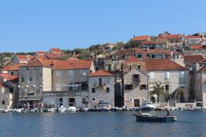 On boat with boaters in harbor at Brač island