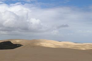 Sand dunes with clouds