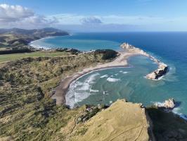 Drone view of Deliverance Cove, Castle Rock and Castlepoint Lighthouse