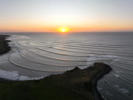 Sunset seen of Cape Egmont seen from drone