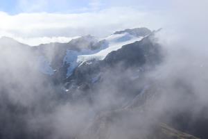 In clouds and mountain seen on summit of Avalanche Peak