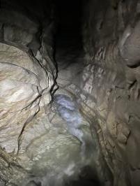 Inside cave going upstream with fast stream