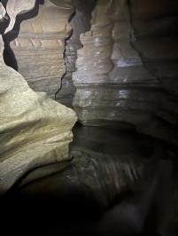 Inside cave going upstream with zig zig passage