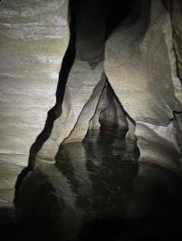 Inside cave water going upstream with zig zag rocks