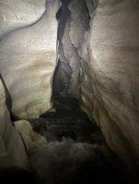 Inside narrow cave going upstream