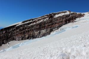 Large icicles on rocks seen while descending Mt. Rainier