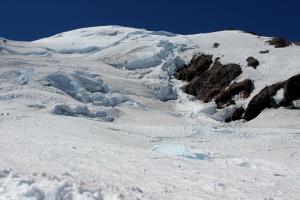 Looking up towards the summit from Ingraham Flats with climbers on left