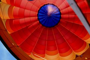 Looking up into fire from helium into hot air balloon