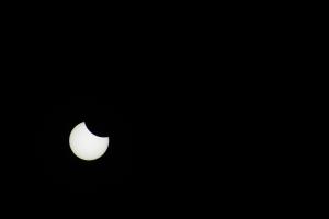Moon starting to cover sun during eclipse