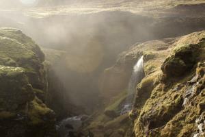 Small waterfall with mist on Fimmvörðuháls Trail