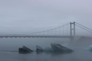 Bridge with icebergs seen from land