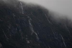 Waterfalls with clouds seen in Doubtful Sound