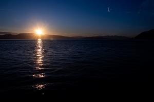Midnight sun seen from boat returning to Tromsø